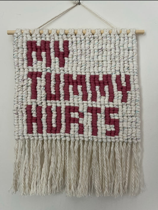 My tummy hurts wall hanging